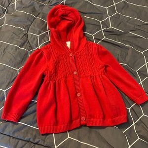 Red button up sweater